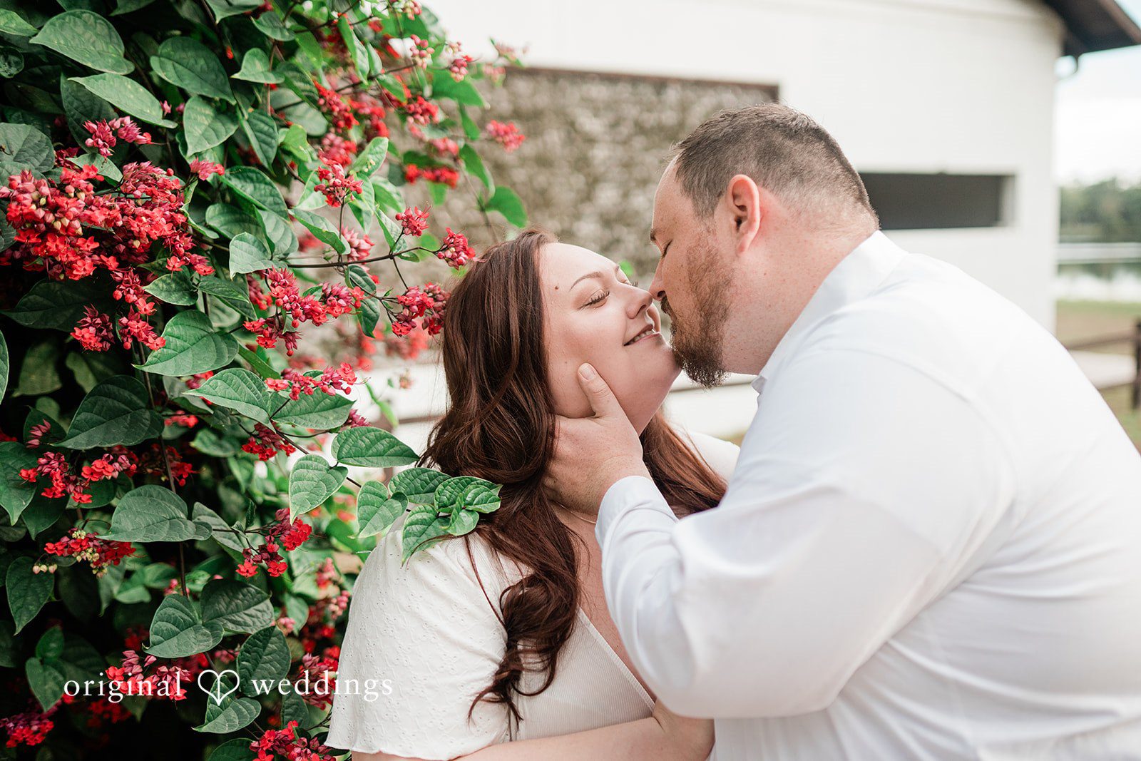 Couple sharing a kiss at The Barn at Crescent Lake in Odessa