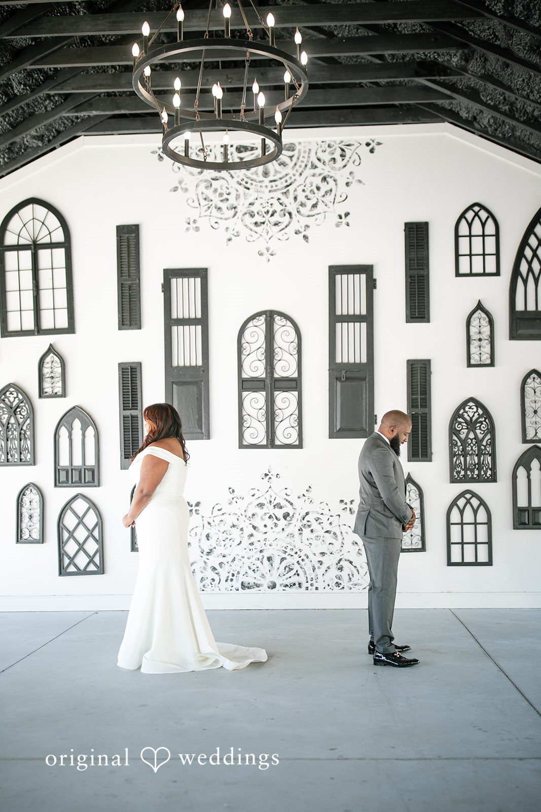 A stylish portrait of the couple by the barn