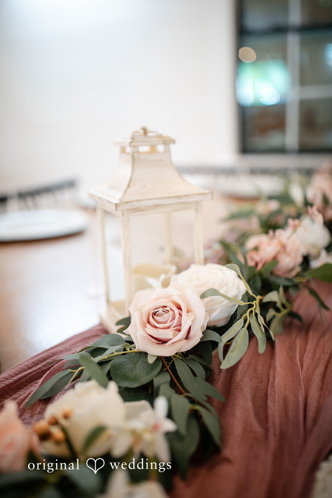 A detail shot of the floral arrangement at The Black Barn wedding reception