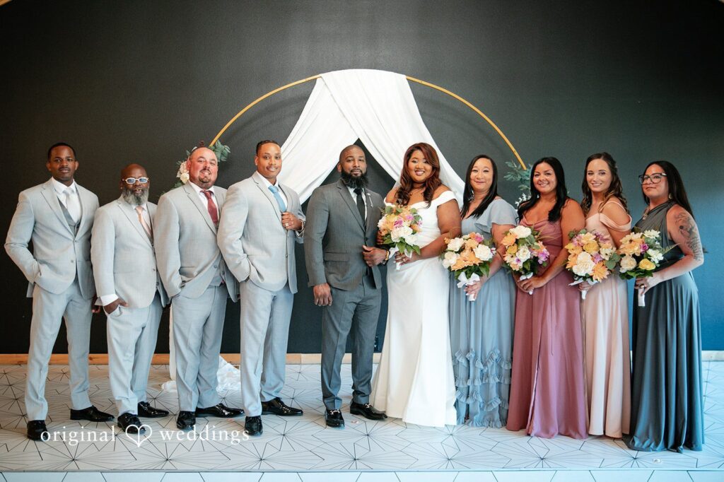Our Orlando wedding photographers at Original Weddings captured a beautiful portrait of the couple with their bridal party at The Black Barn