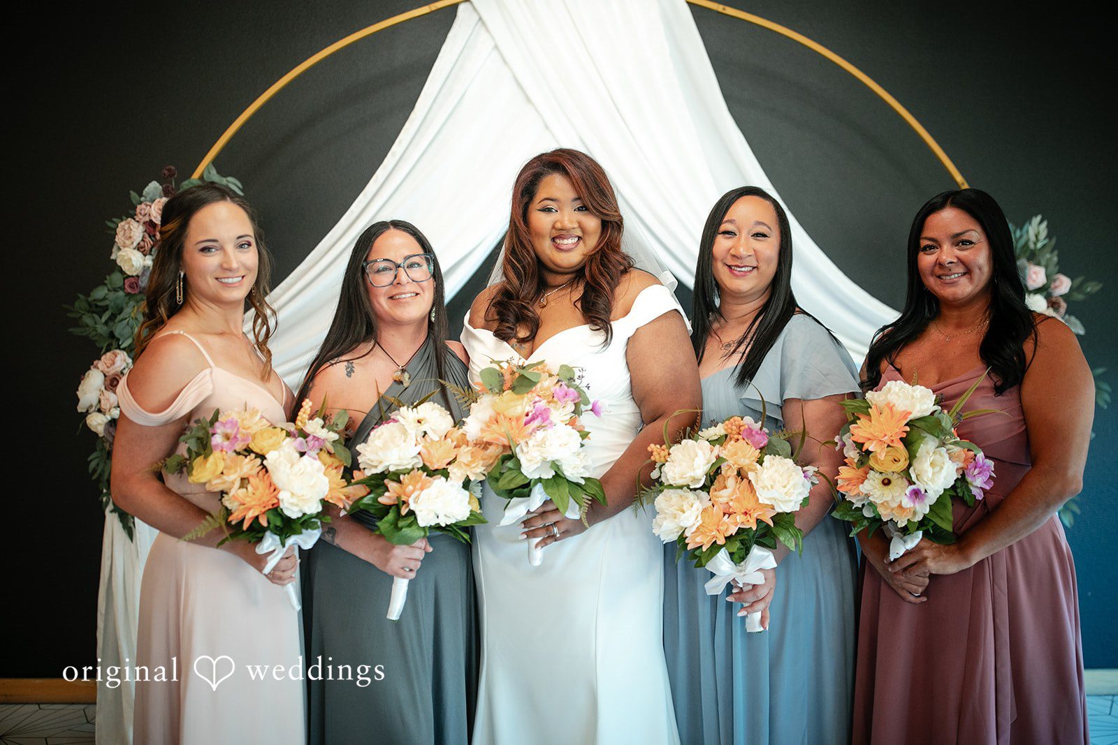 A stunning portrait of the bride and her bridesmaids