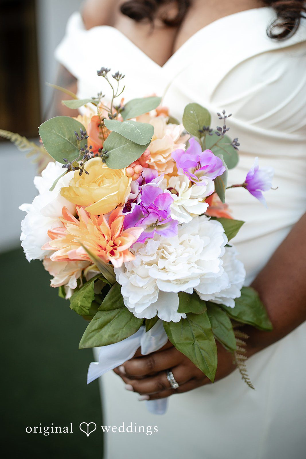 A close-up shot of the bride holding her huge bouquet