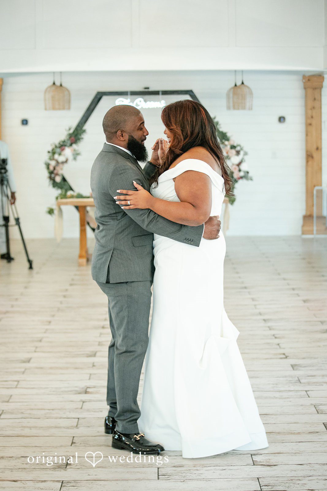 The bride and groom take their first dance