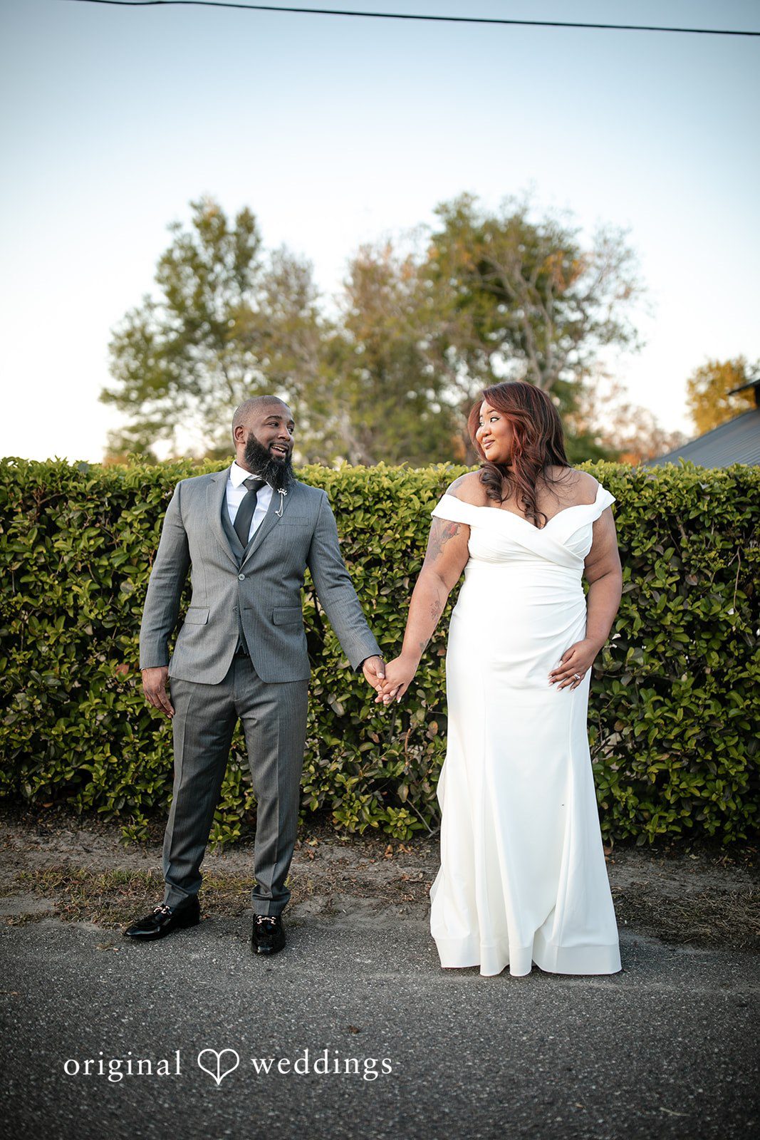 A romantic portrait of the couple in the outdoor area of The Black Barn