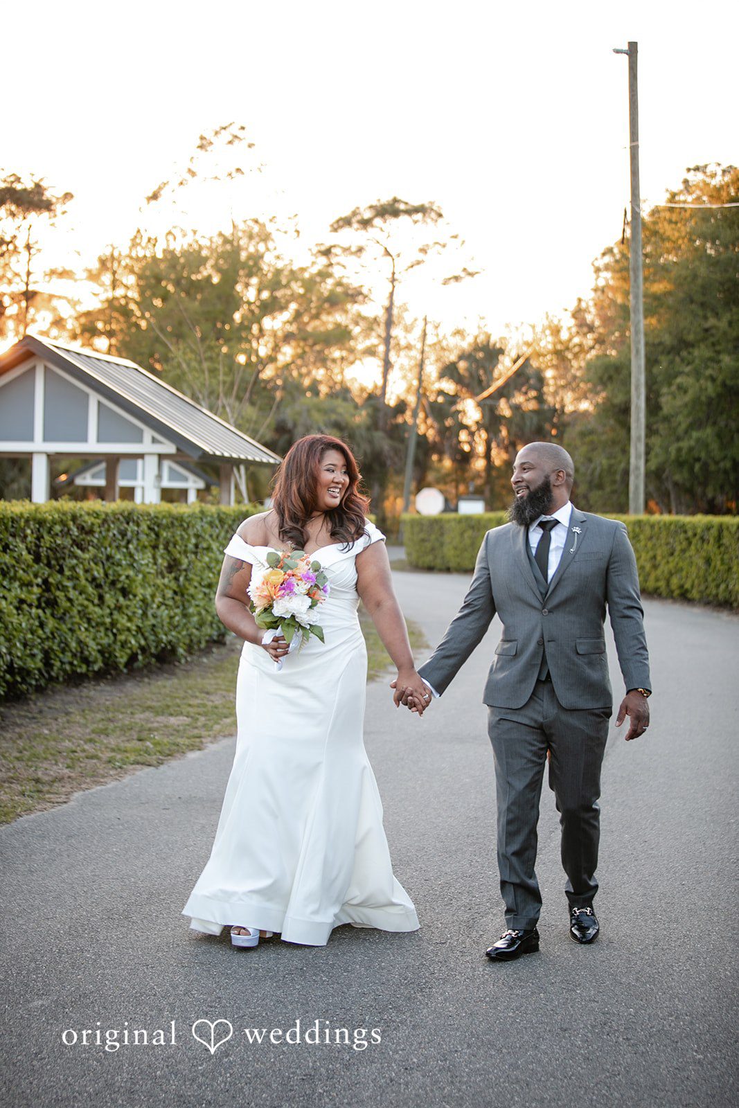A joyful portrait of the couple taking a walk at The Black Barn