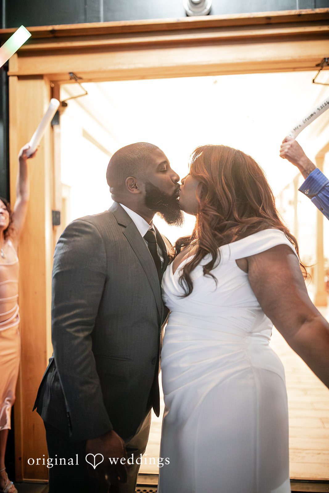 The couple seals the night with a romantic kiss