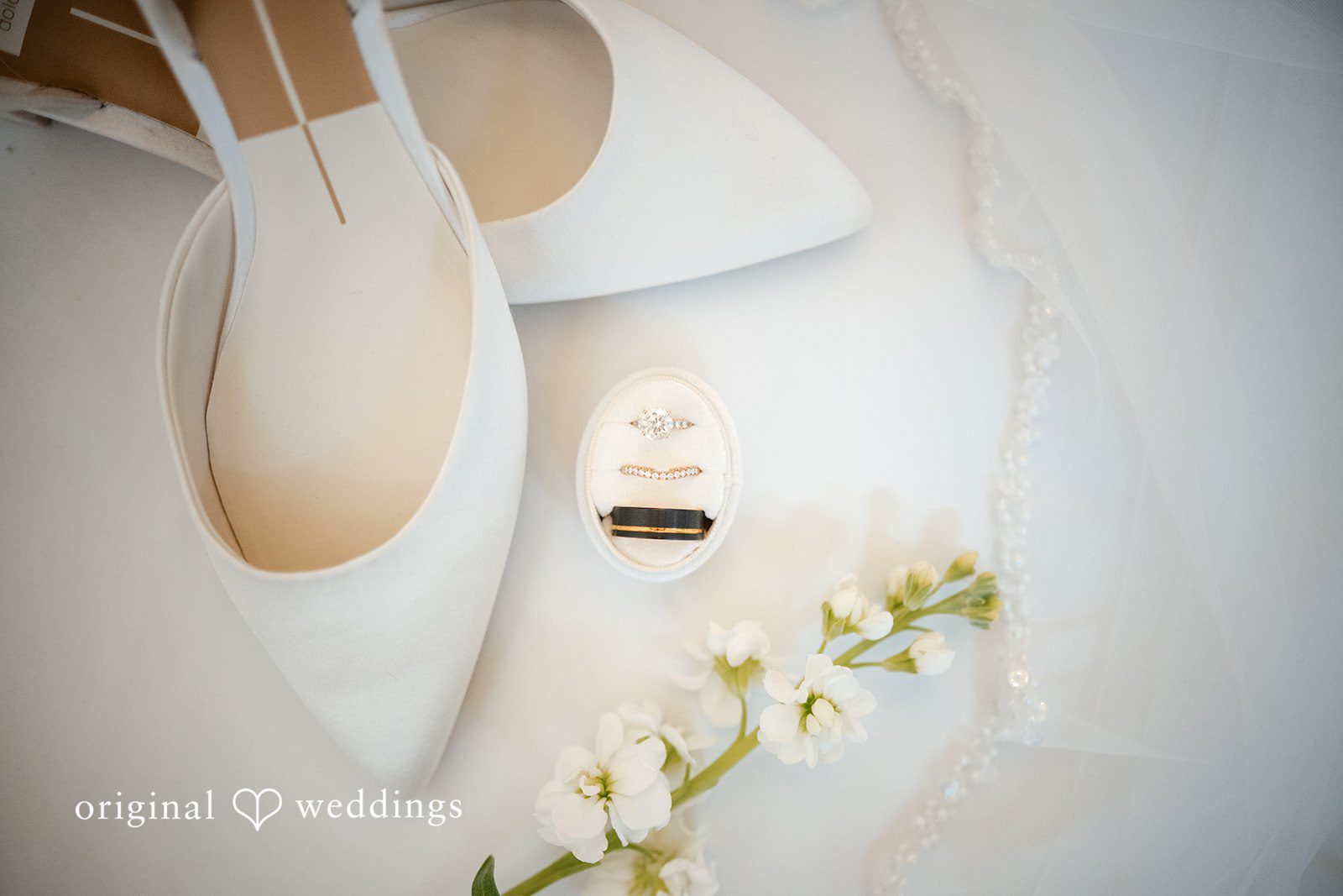 Beautiful picture of bride's shoes and wedding rings