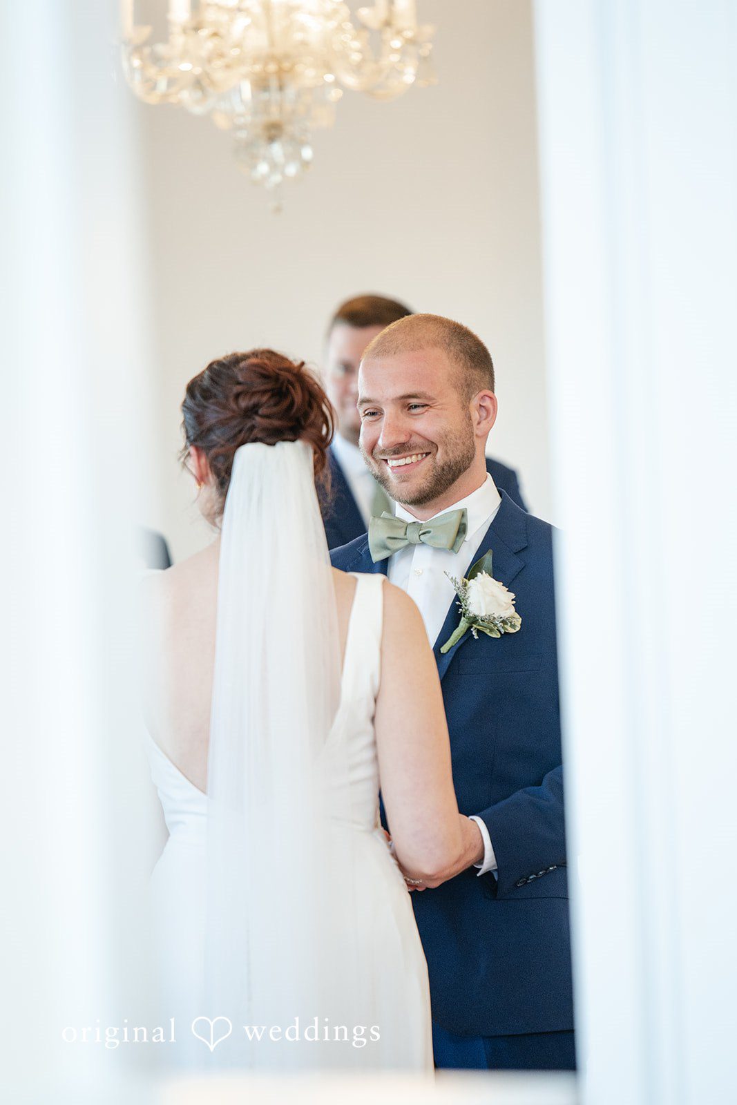 Groom looking at bride happily