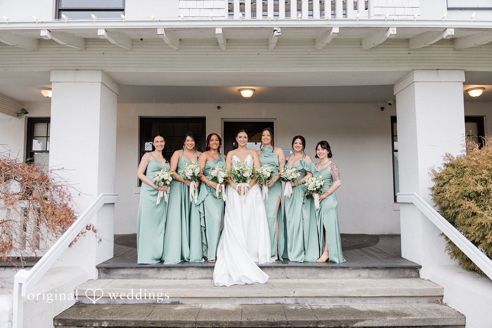 Lovely picture of bride with bridesmaids holding bouquet
