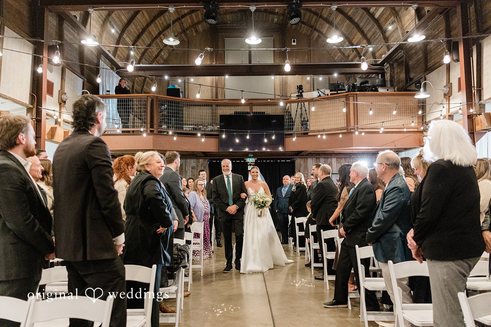 Bride walking arms in arms with her companion