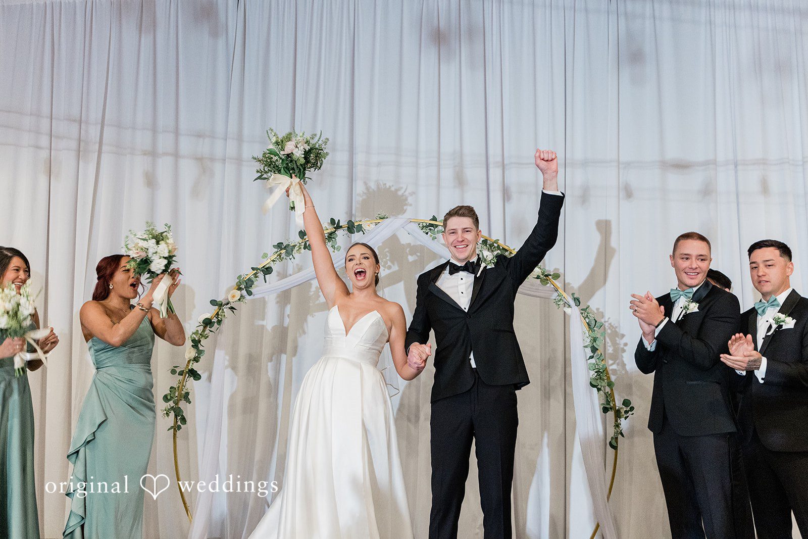 Couple expressing their joy after wedding ceremony