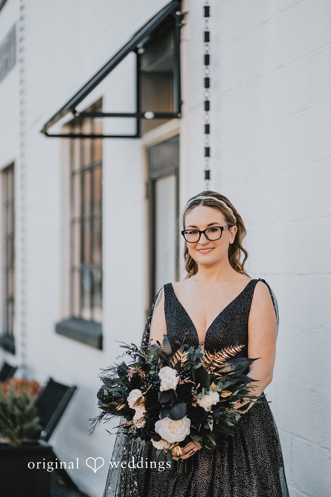 Dianna + Devin A beautiful portrait of the bride holding her huge bouquet