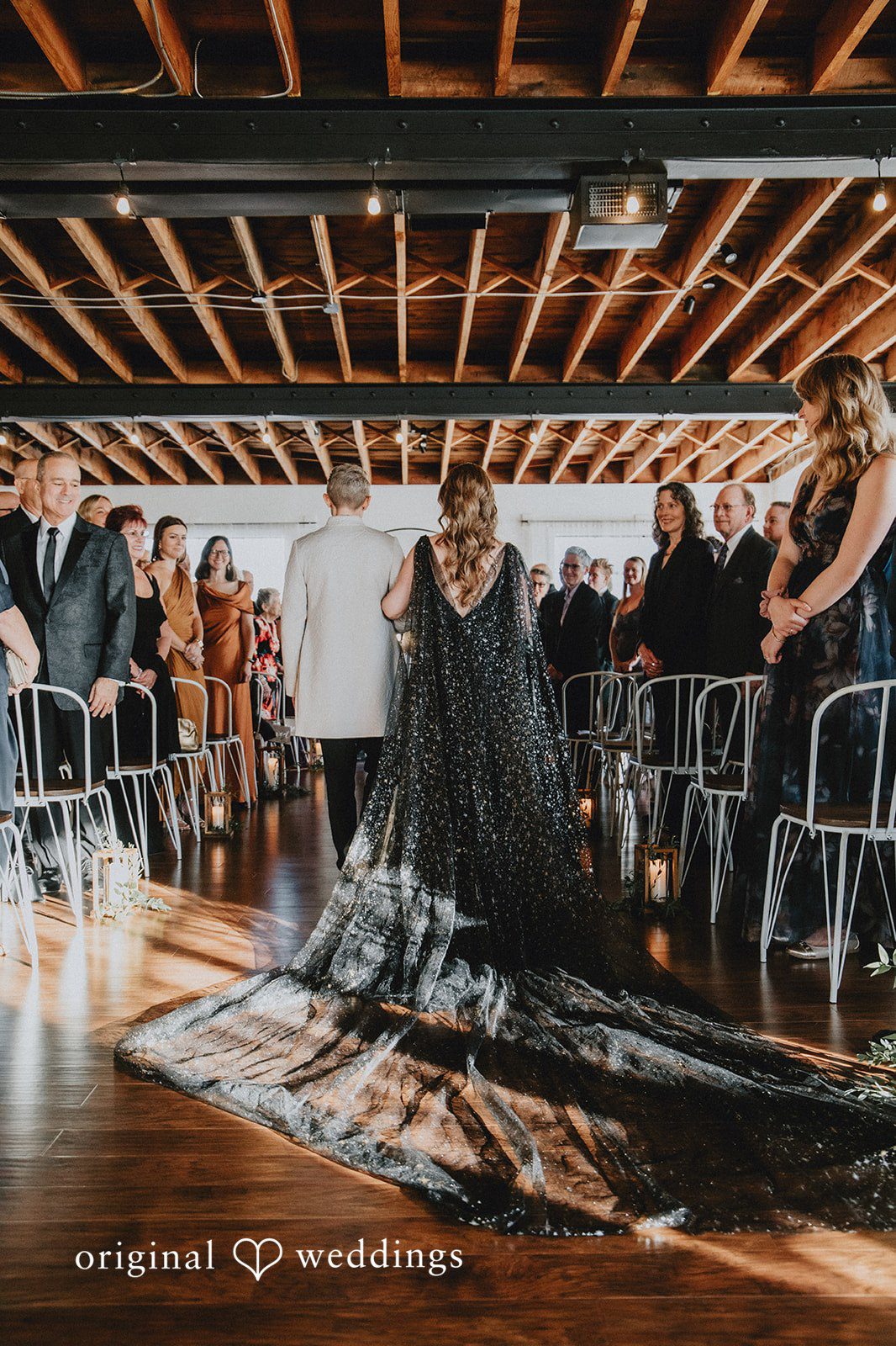 Dianna + Devin A portrait of the bride and groom walking down the aisle