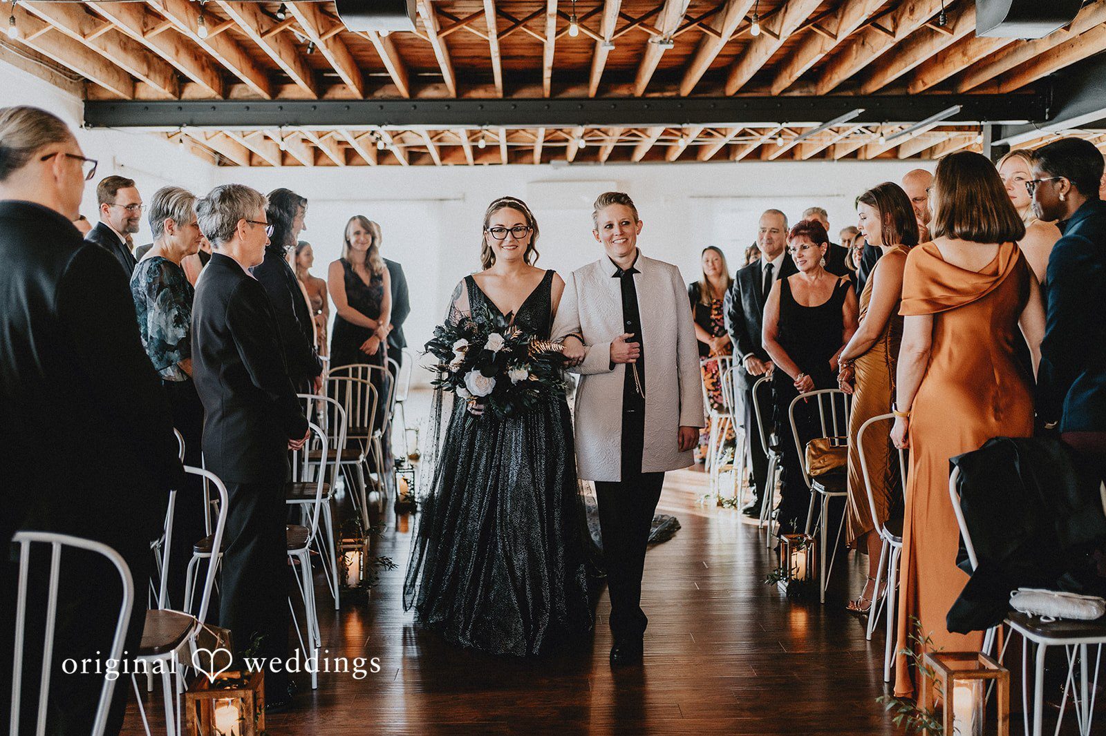 Our DC wedding photographers at Original Weddings took a beautiful portrait of the bride and groom walking down the aisle at The Refinery wedding ceremony