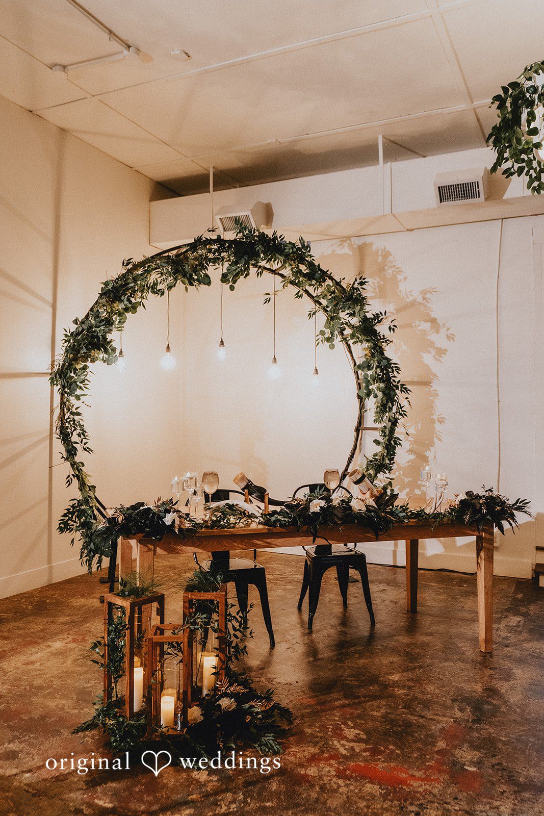 Dianna + Devin Decorated table with fresh green florals and candles