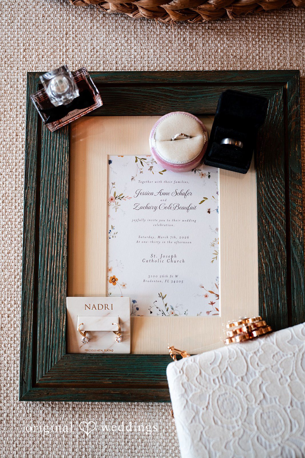 Elegant wedding details with perfume and rings