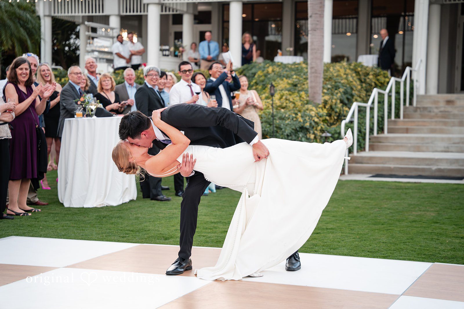 Couple enjoying their dance with a kiss at The Resort at Longboat Key Club.