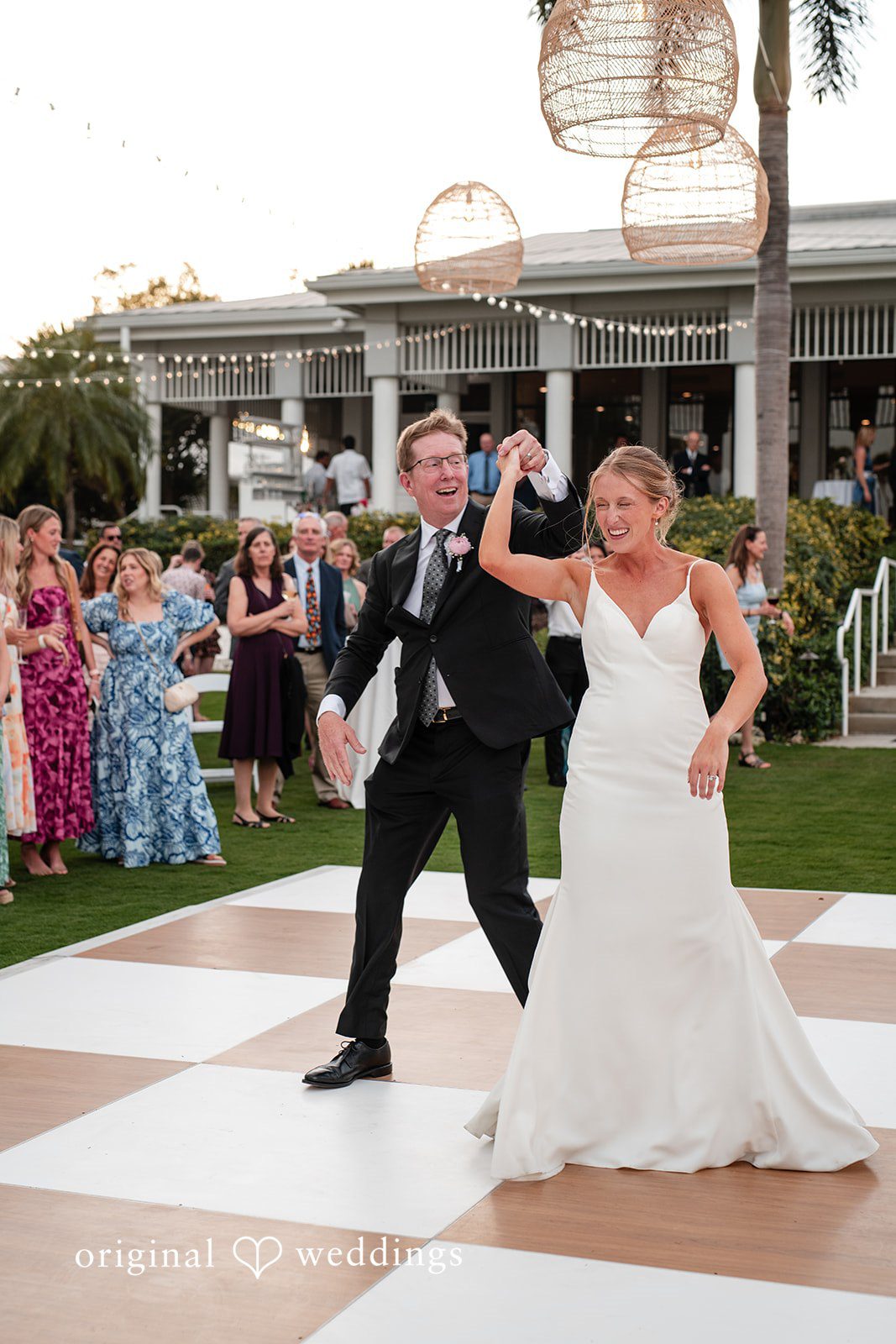 Couple entering the reception to celebrate their wedding at The Resort at Longboat Key Club