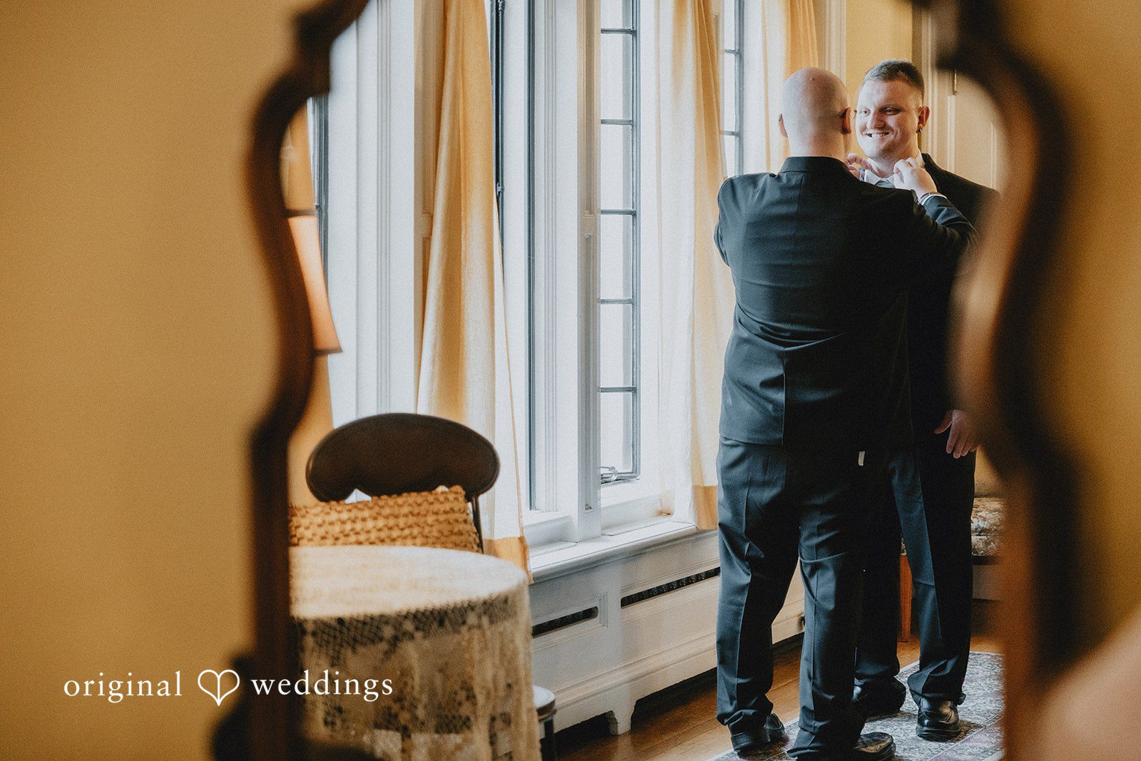 Kaydee + Jameson Groom getting ready adjusting his suit