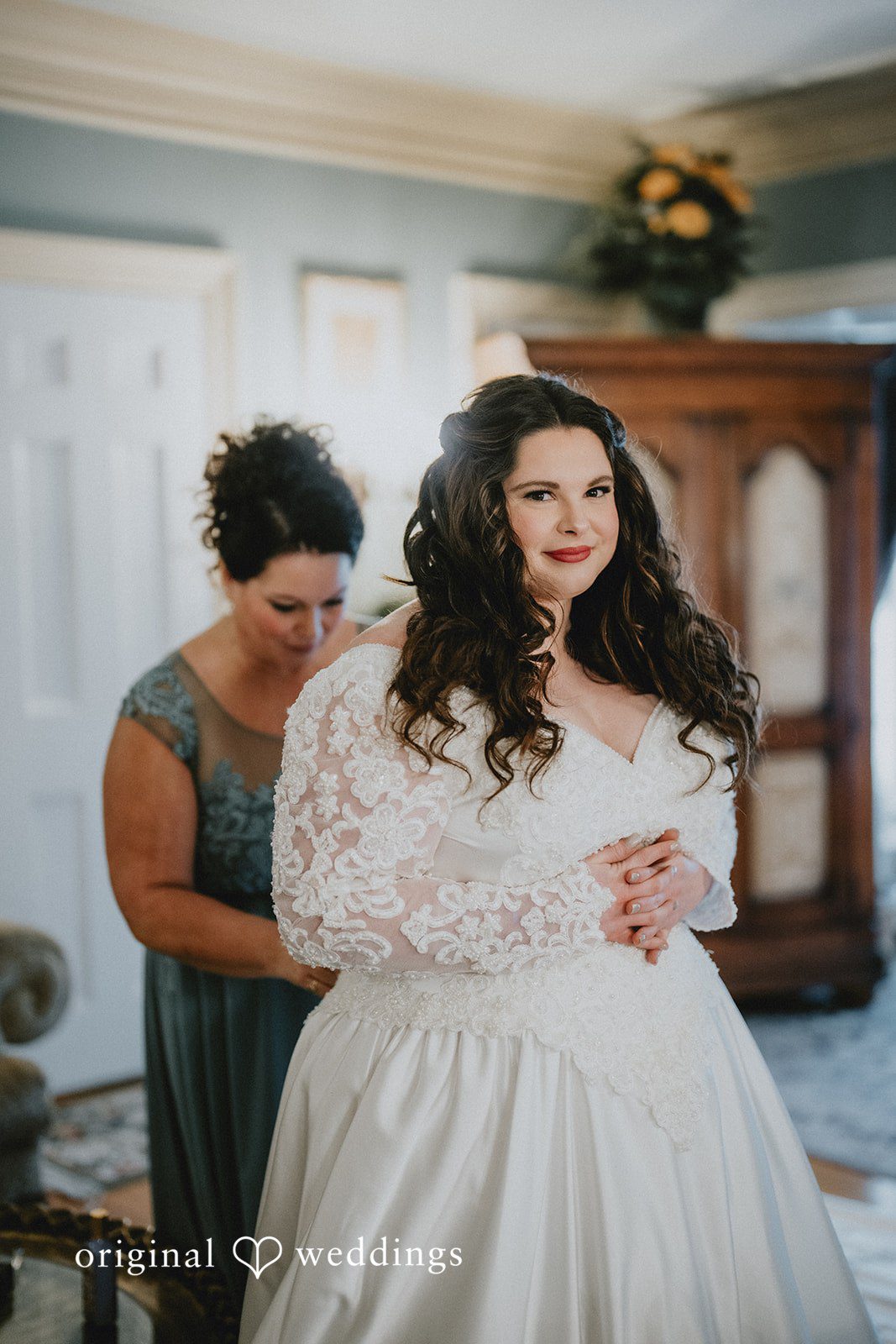 Kaydee + Jameson Bridesmaid adjusting bride dress before ceremony
