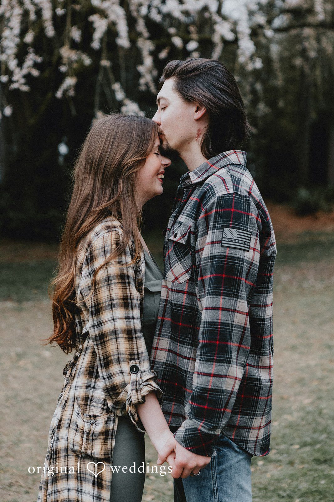 Close-up of groom giving a forehead kiss to bride during photo session at Volunteer Park