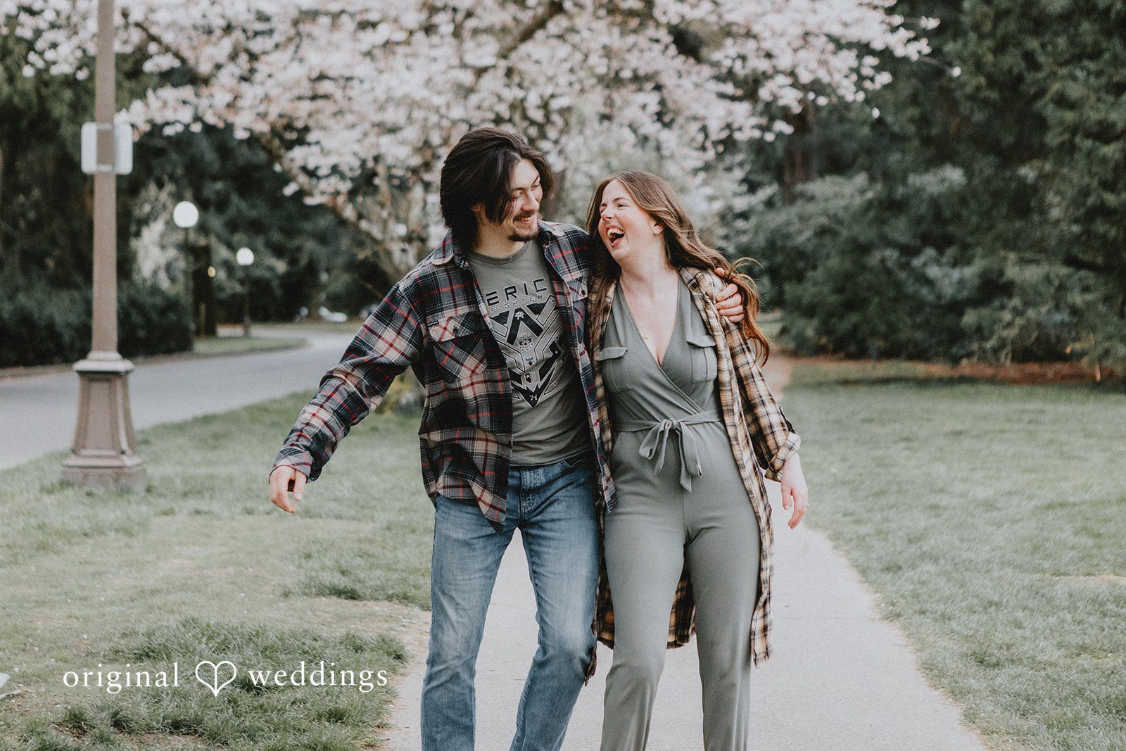 Couple posing together and smiling naturally at Volunteer Park