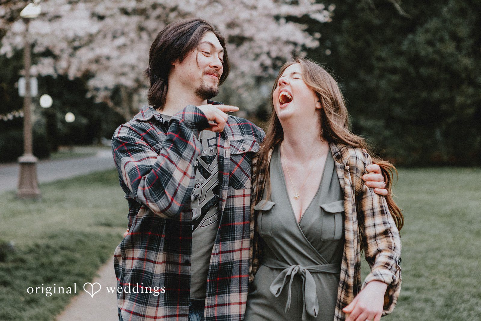 Couple posing together and smiling naturally at Volunteer Park