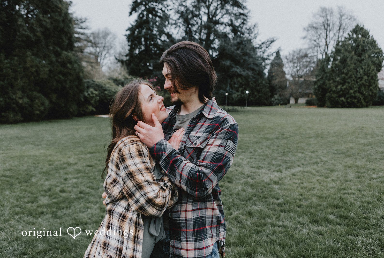 Engagement photography services by Original Weddings capturing happy couple smiling at Volunteer Park