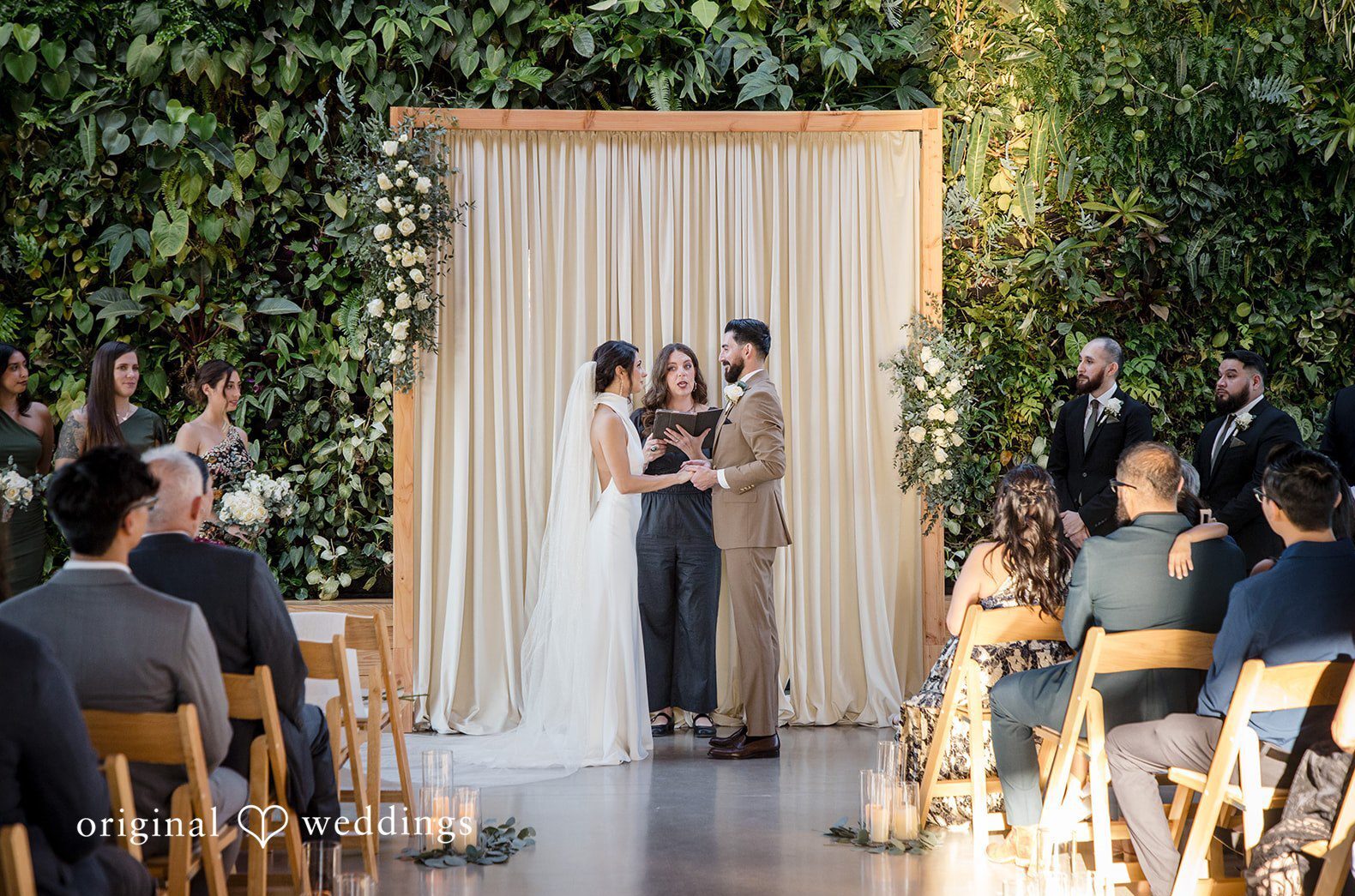 Austin wedding photography capturing an intimate indoor ceremony at Walden Retreats with natural greenery and soft light.