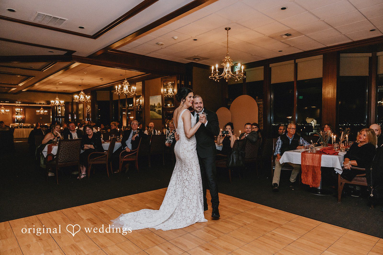 Parsa + Kiley The couple shares their first dance in a romantic atmosphere.