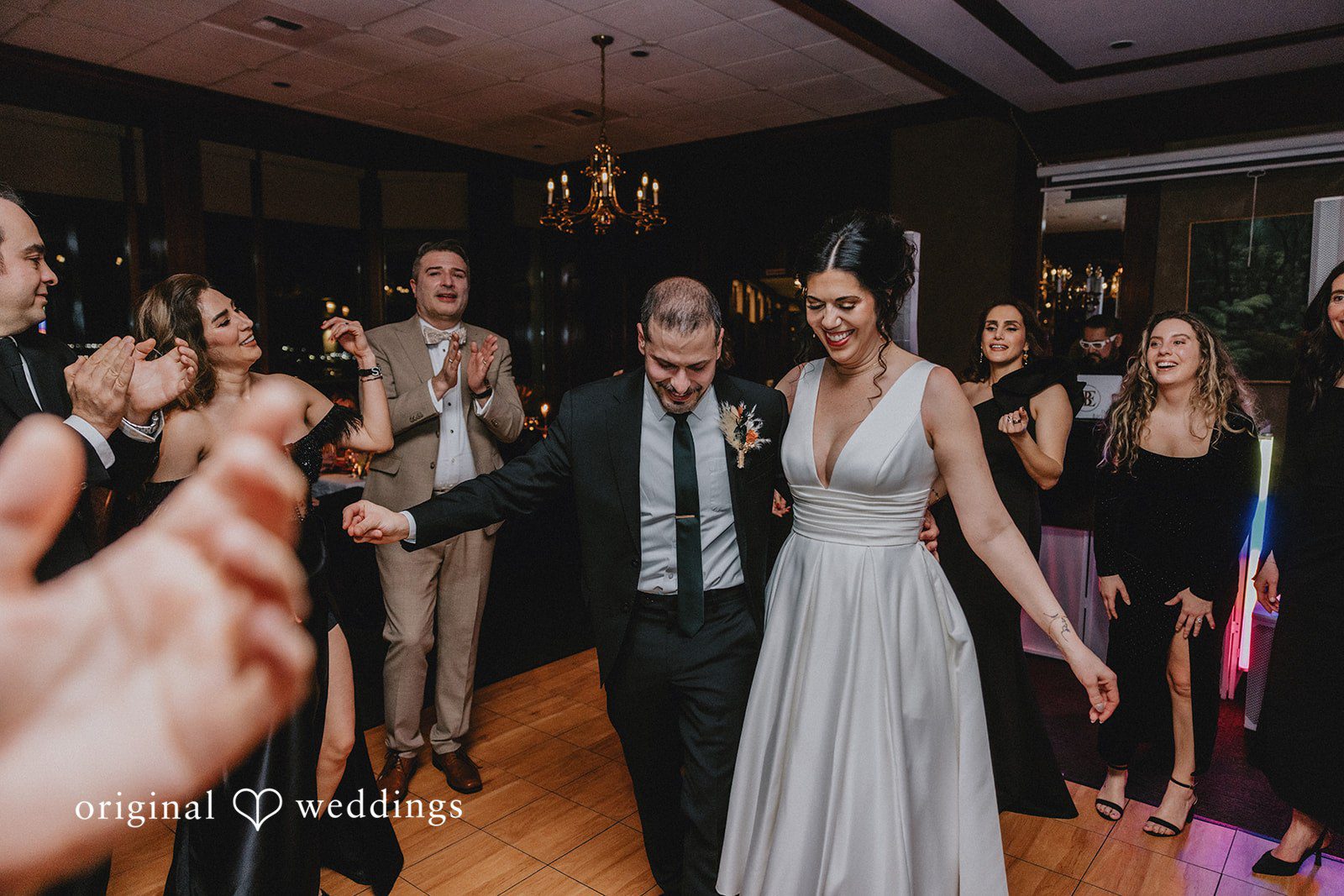 Parsa + Kiley Guests dance energetically, bringing life to the celebration.