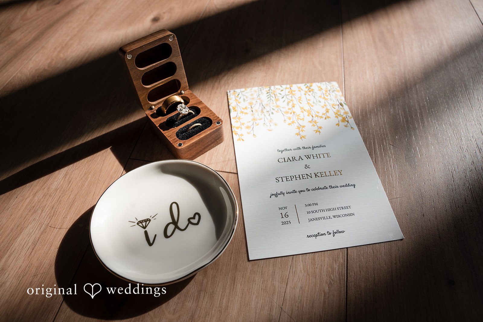 Wedding rings and invitation suite styled together