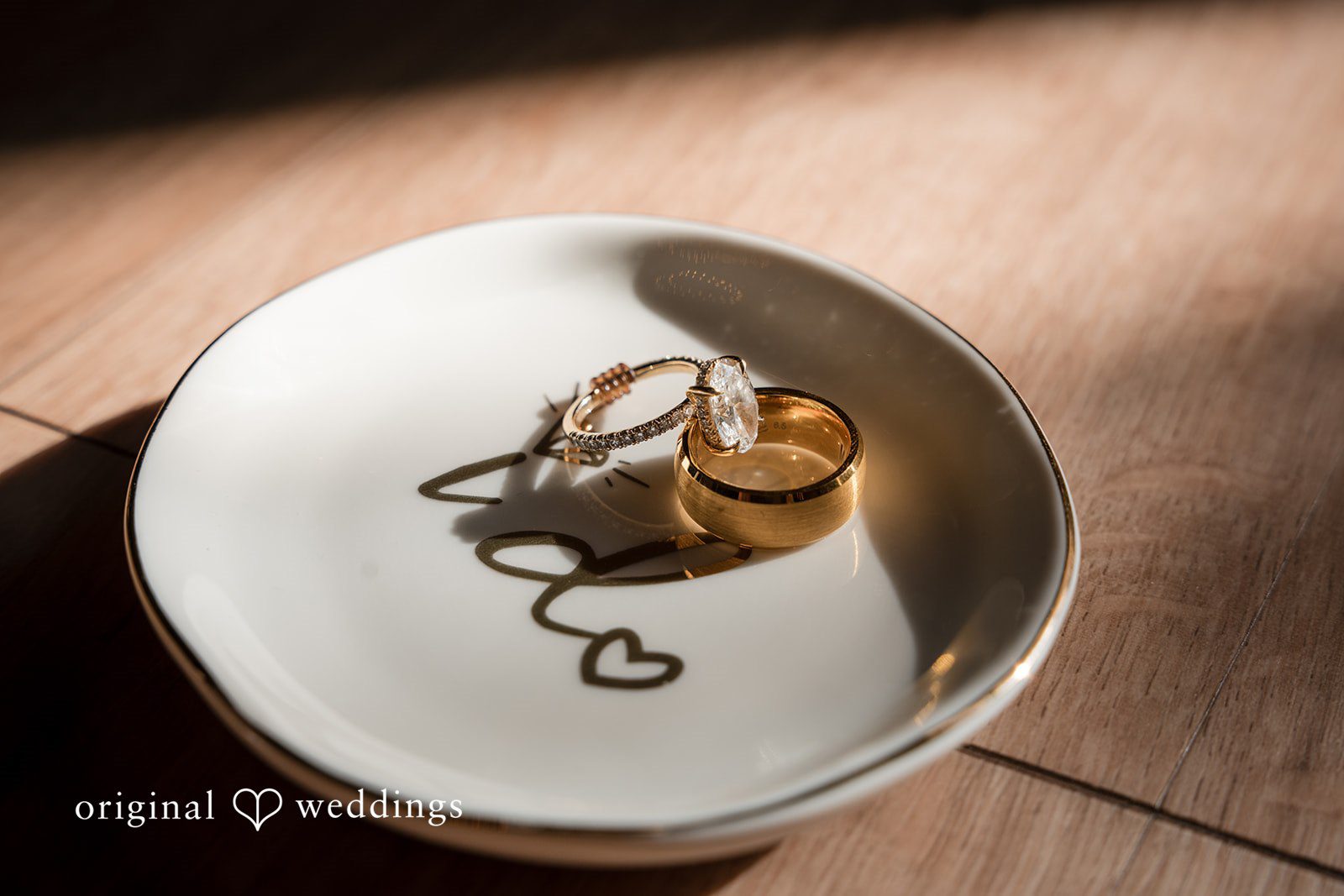 Close-up detail of the couple’s wedding rings
