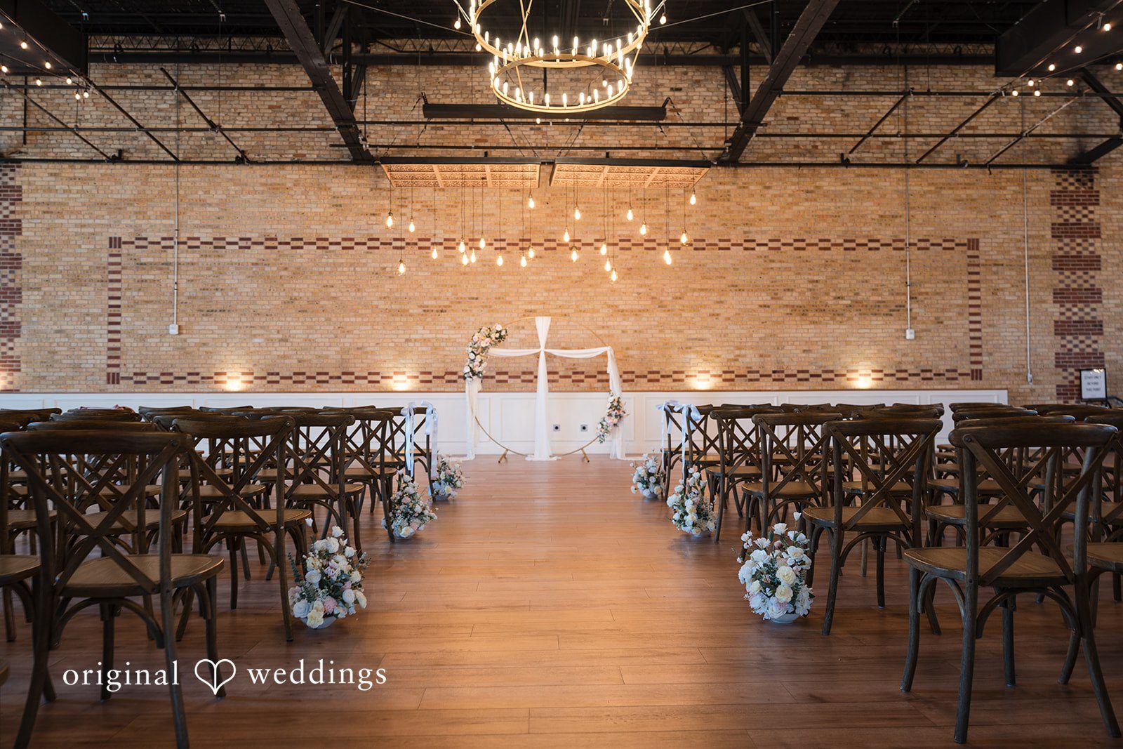 Indoor ceremony setup with elegant floral details