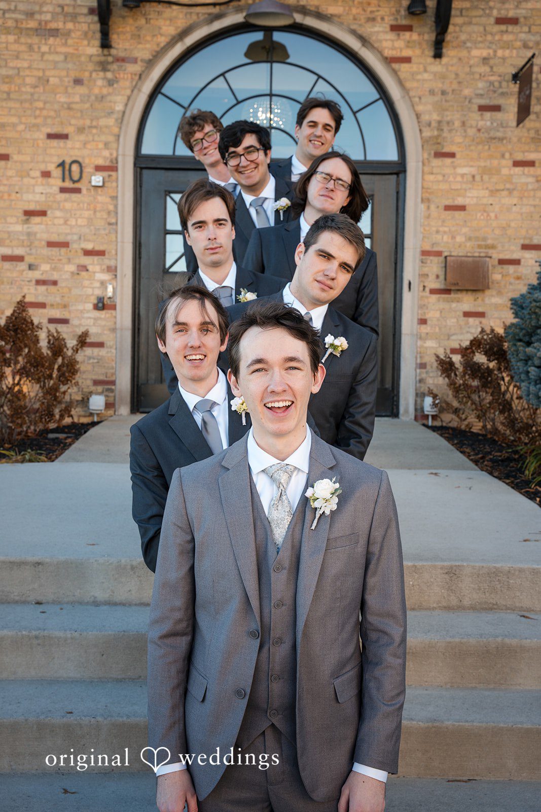 Groom posing with groomsmen before the ceremony