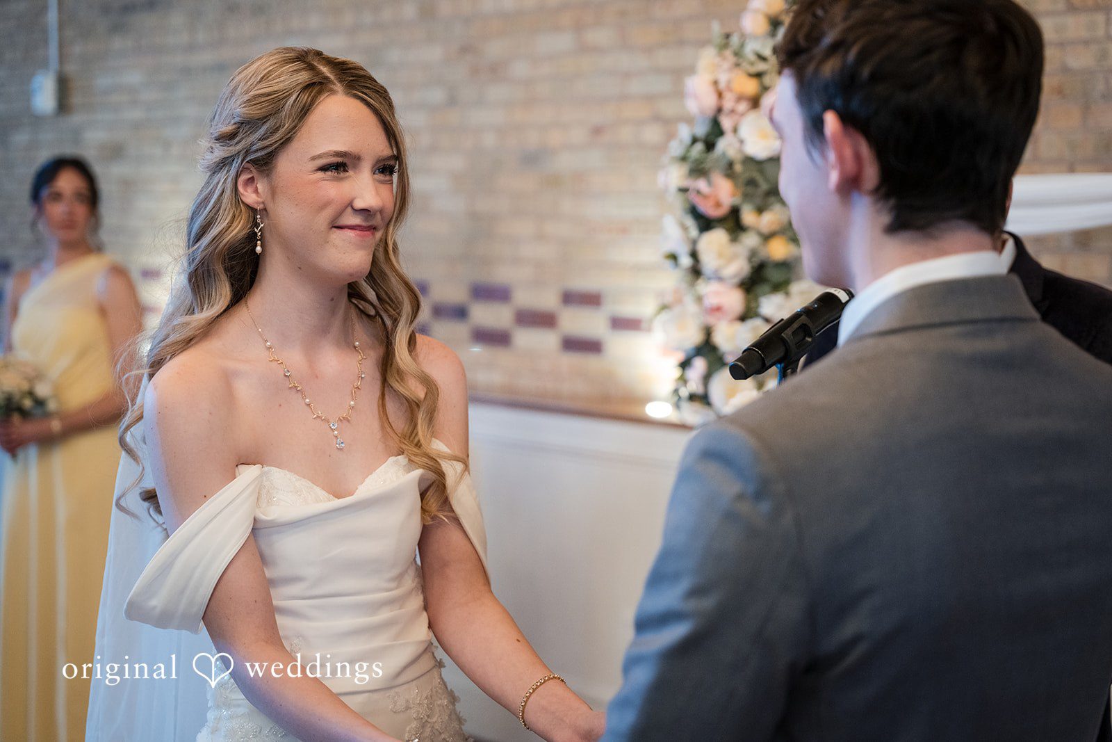 Bride and groom holding hands during the ceremony