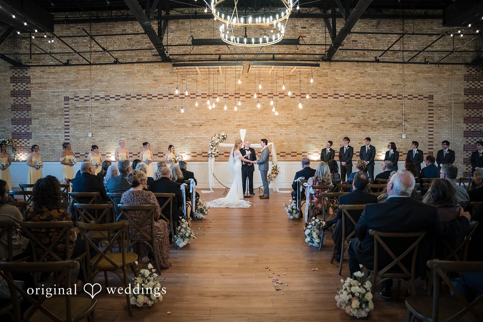 Wide-angle view of the indoor wedding ceremony