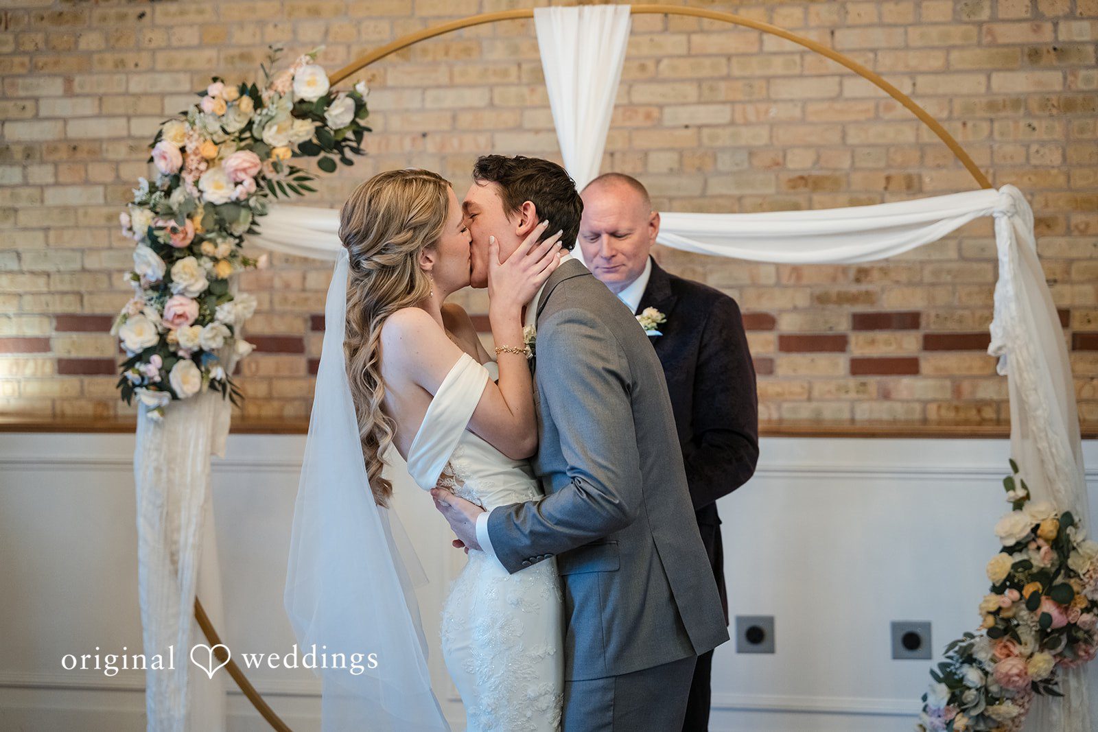 Couple sharing a kiss after the ceremony