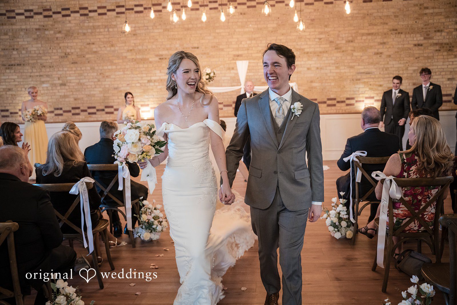 Newlyweds walking hand in hand after the ceremony