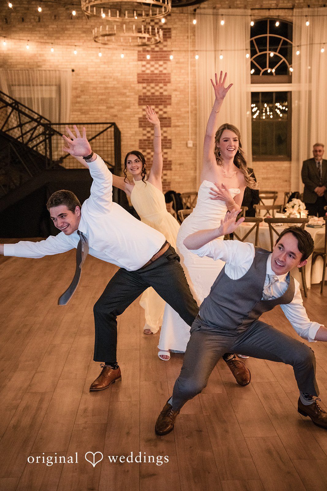 Wedding guests celebrating together at the reception