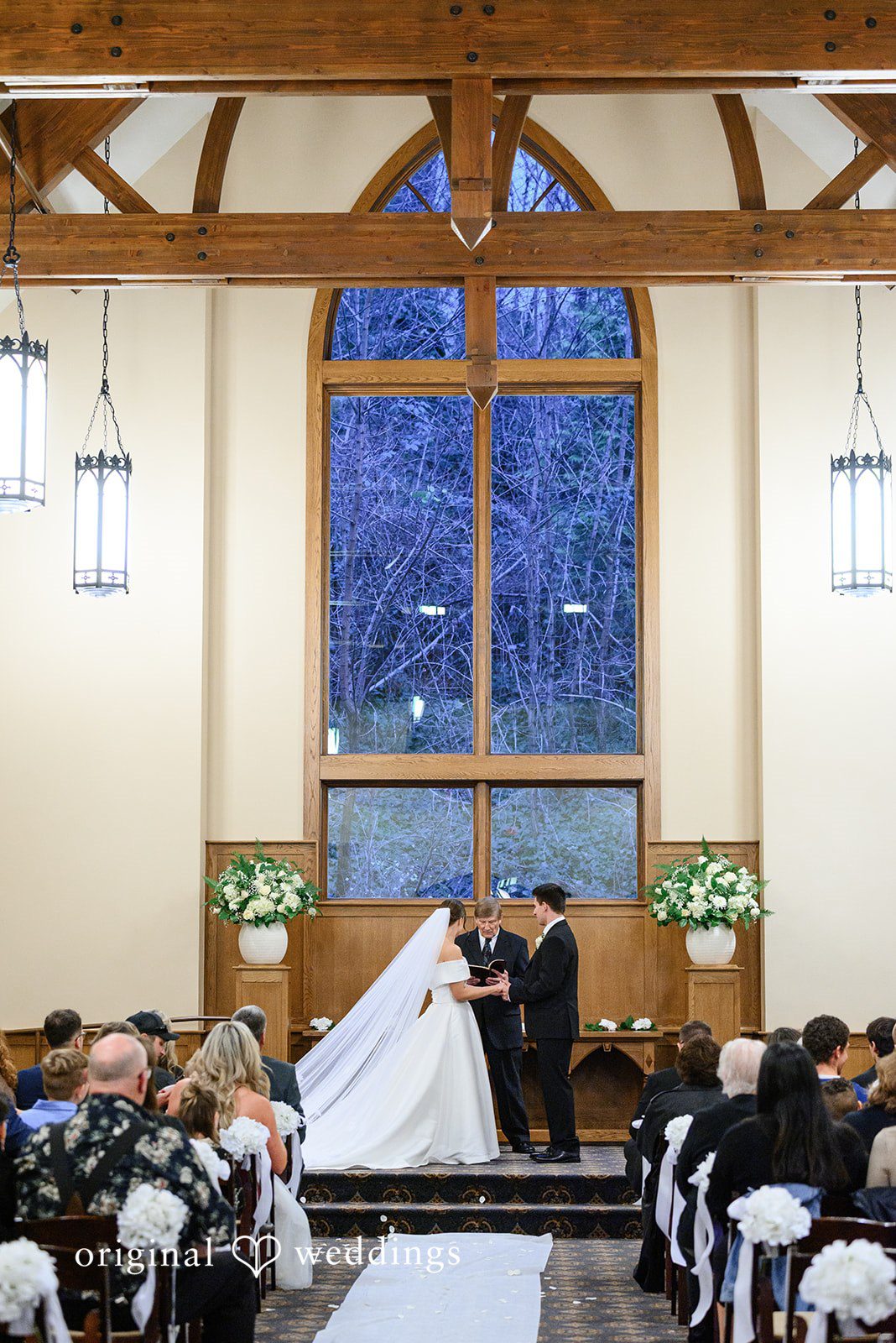 Avery + Ben Couple exchanging vows during ceremony at Abernethy Center