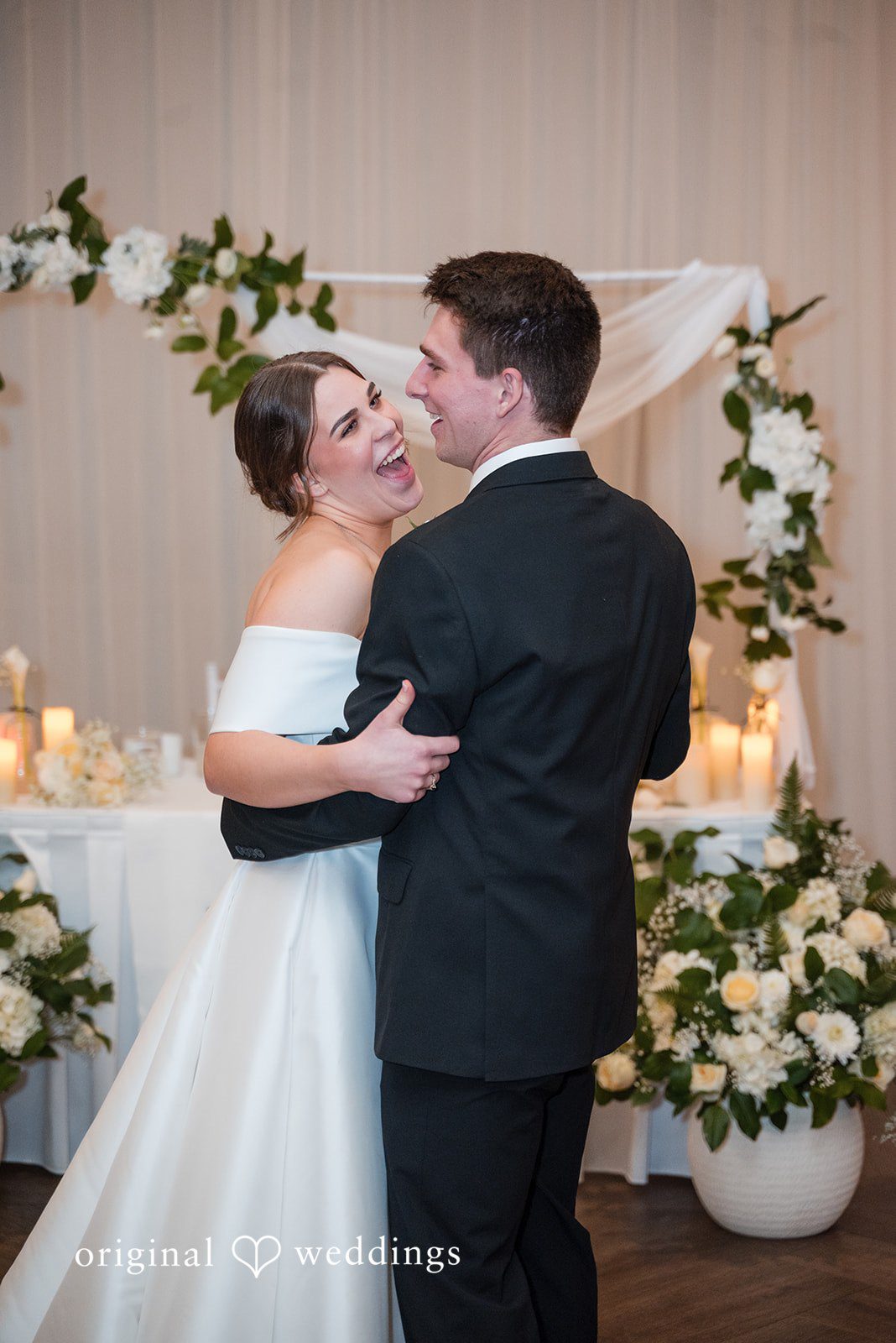 Avery + Ben Bride and groom hugging and expressing their joy