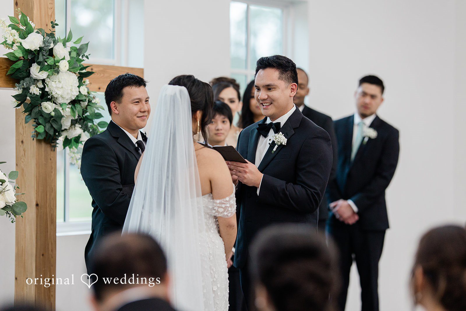Dominic + Erika Joy Groom looking at a bride during a wedding ceremony.
