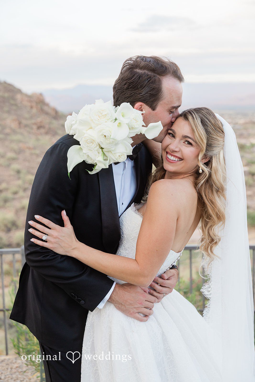 Kathryn + Calum Groom embracing the bride during a romantic portrait session