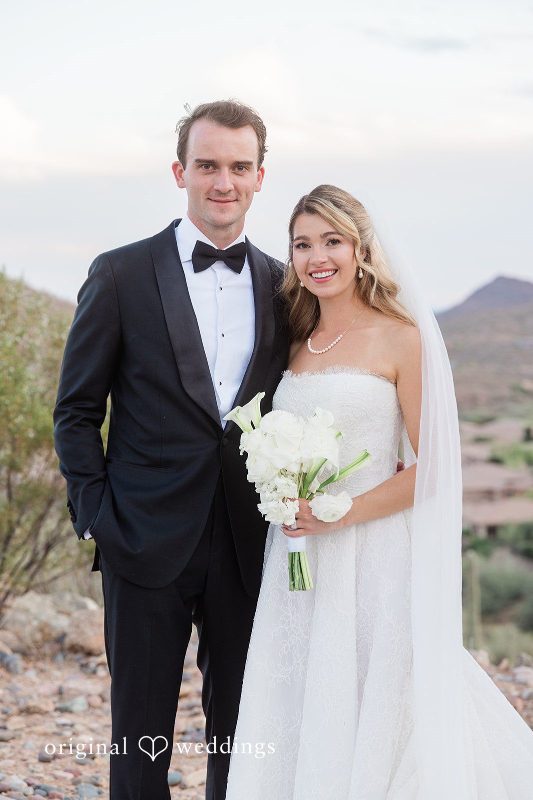 Kathryn + Calum Bride and groom posing together outdoors at the venue