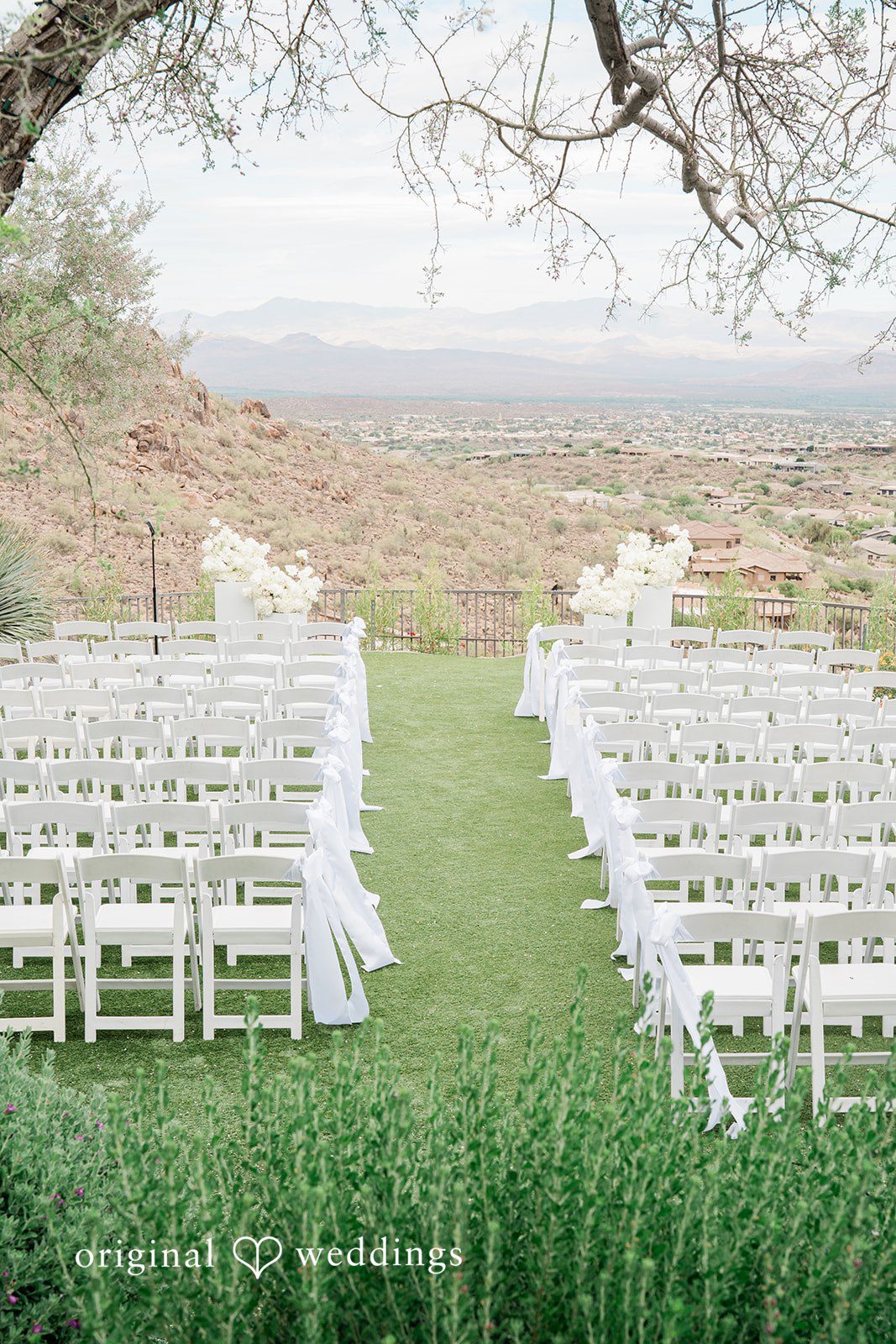 Kathryn + Calum Outdoor wedding ceremony setup at the venue surrounded by natural scenery