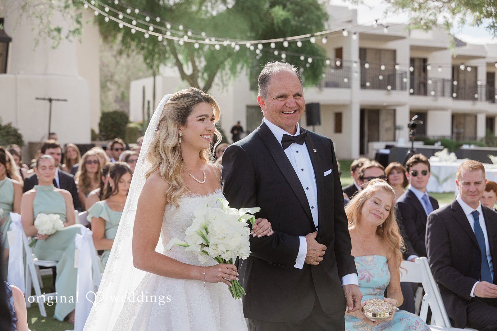 Kathryn + Calum Bride walking with her father toward the reception area