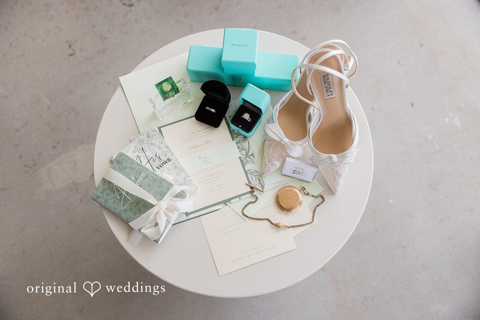 Kathryn + Calum Bridal shoes and wedding invitations styled together on a table