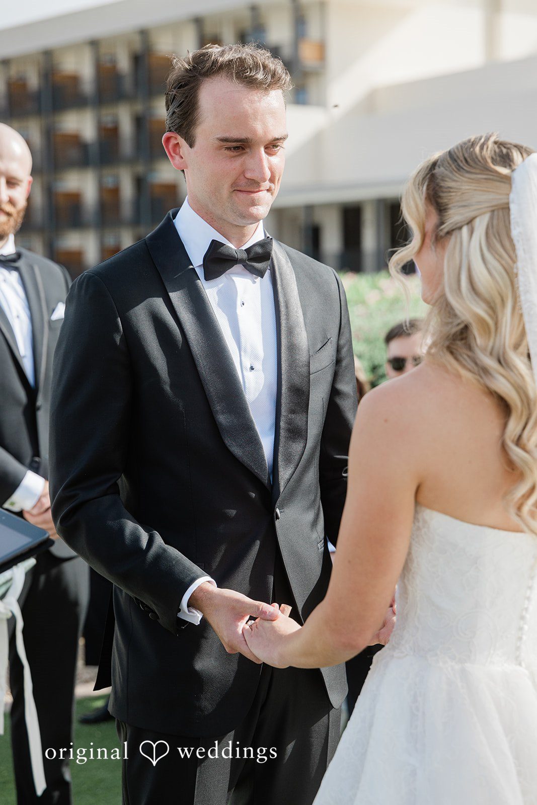 Kathryn + Calum Couple holding hands together at the reception venue