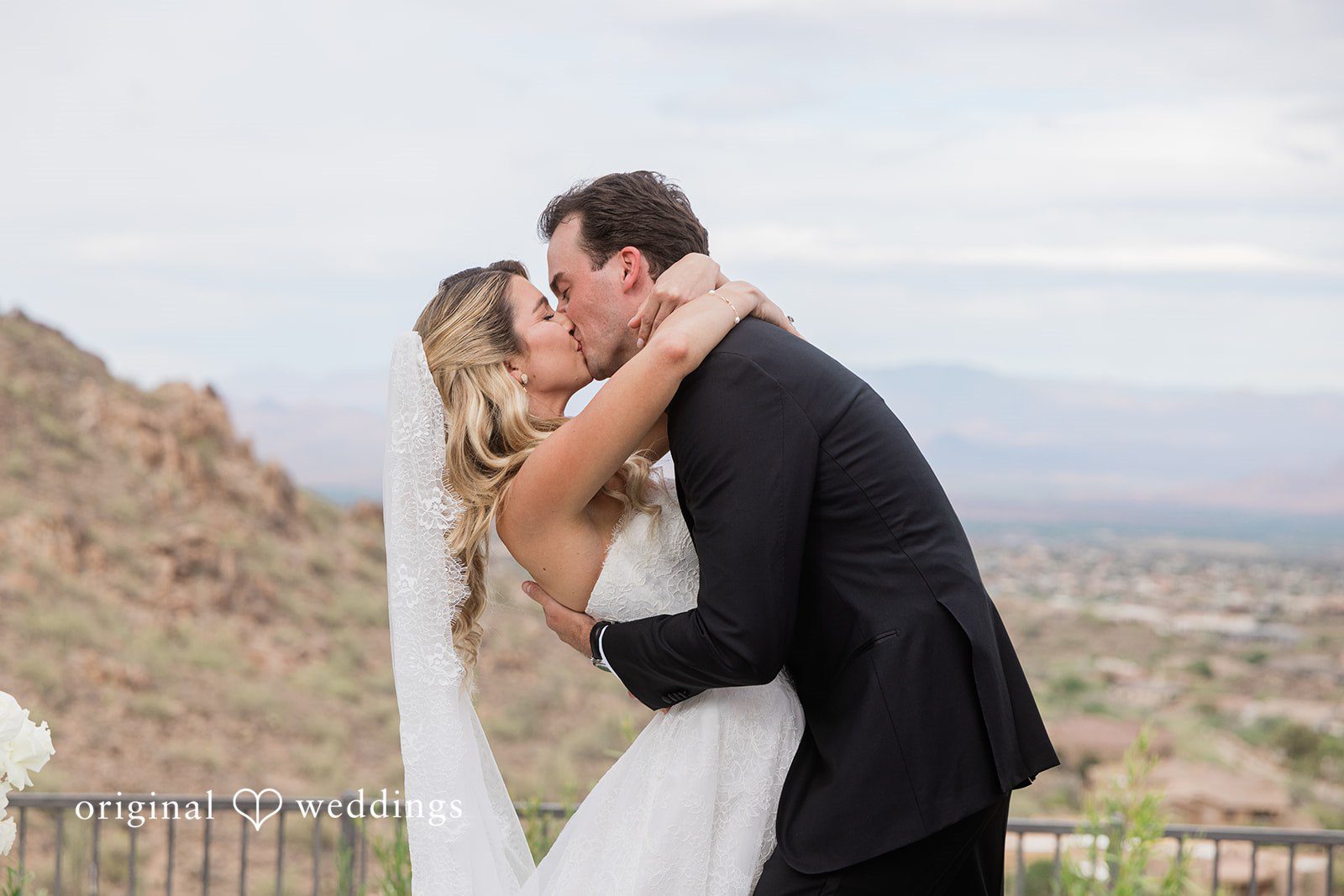 Kathryn + Calum Couple sharing a kiss after the wedding ceremony